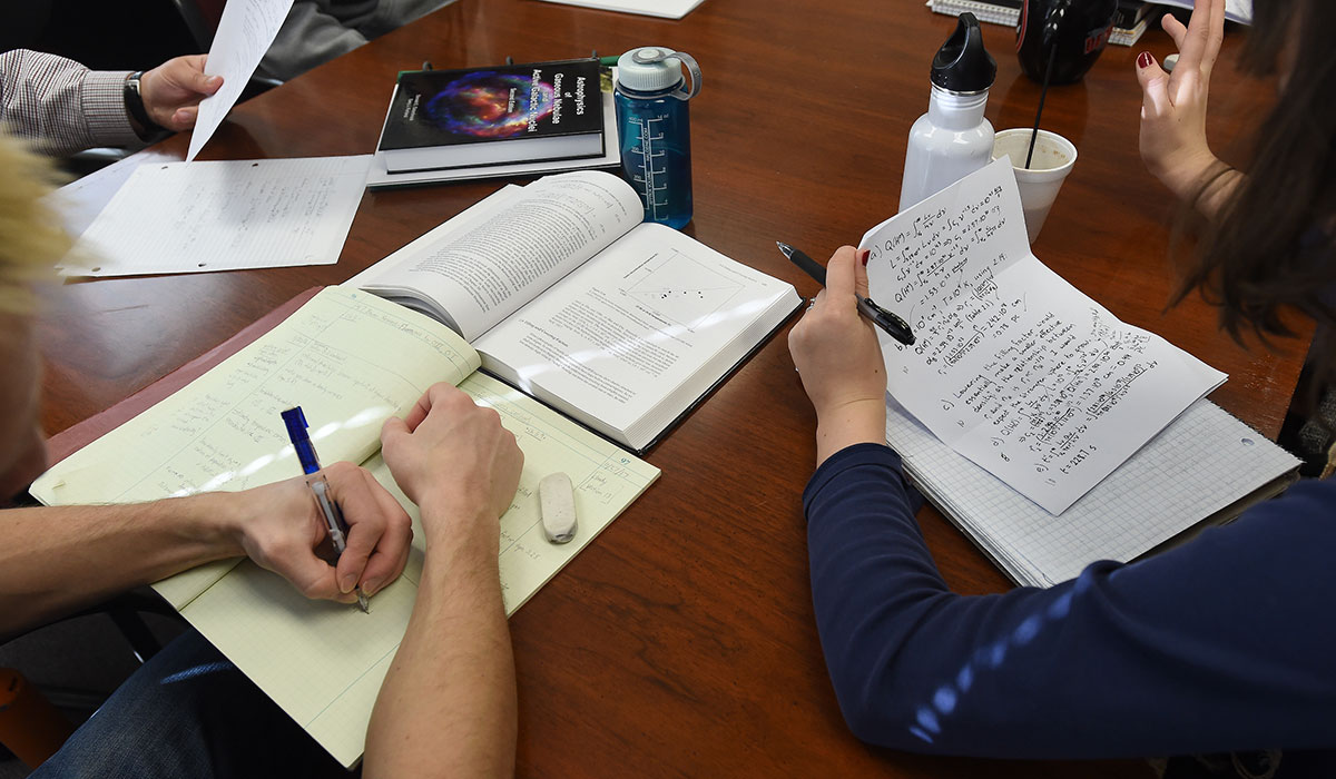 Physics students studying