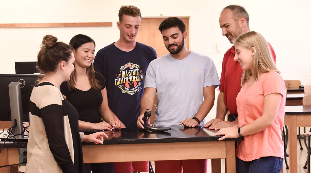 students in the lab with their professor