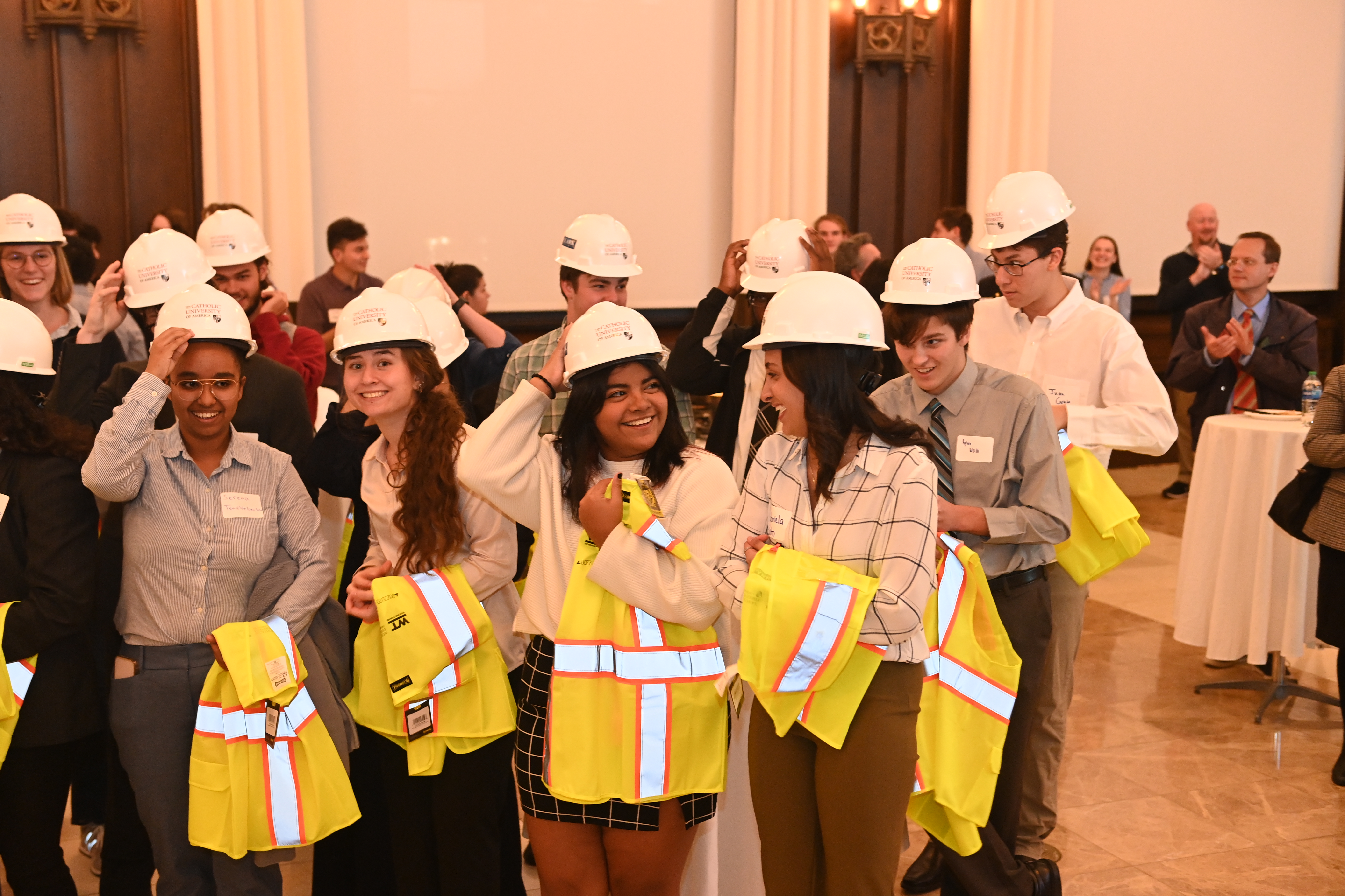 students smile in their new hard hats