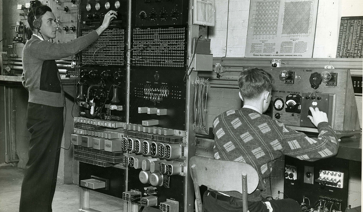 Electrical engineers using a telephone in 1939