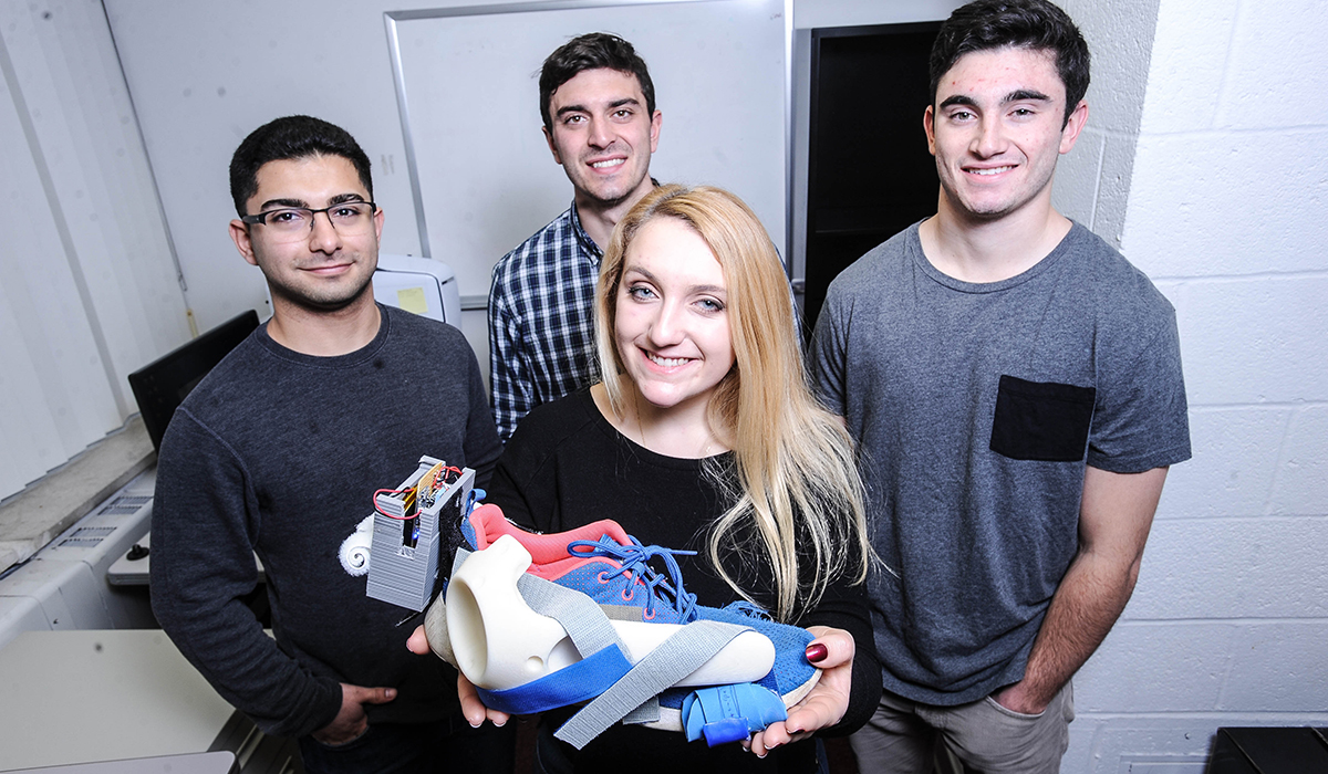Students with a shoe project
